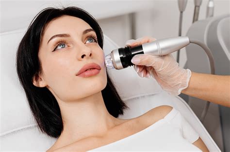 A Young Woman Undergoes A Radiofrequency Facelift Procedure Facial Skin Care Antiaging Facial