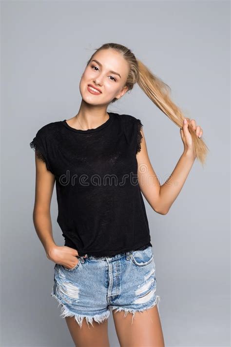 Lovely Charming Happy Woman Wears White T Shirt And Denim Shorts