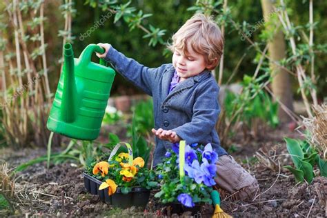 Little Boy Gardening And Planting Flowers In Garden — Stock Photo