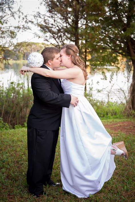 Bride Kissing Groom W Leg Up Remy K Photography