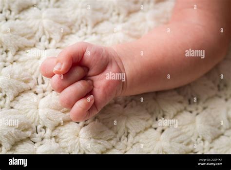 Photo Of Little Newborn Baby Feet With Soft Skin And Blanket Stock