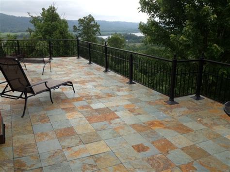 Vintage wood chair on outdoor wooden terrace. Interlocking slate deck tiles - Contemporary - Patio ...