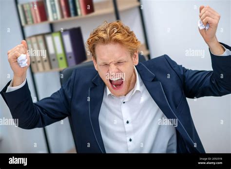 Angry Man With Closed Eyes And Raised Fists Stock Photo Alamy
