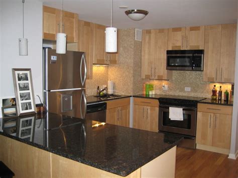 What counters flooring backsplash go with light maple cabinets. natural maple cabinets black granite countertop subway ...