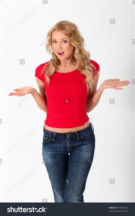 Beautiful Woman Wearing Red Shirt With Surprised Look Stock Photo