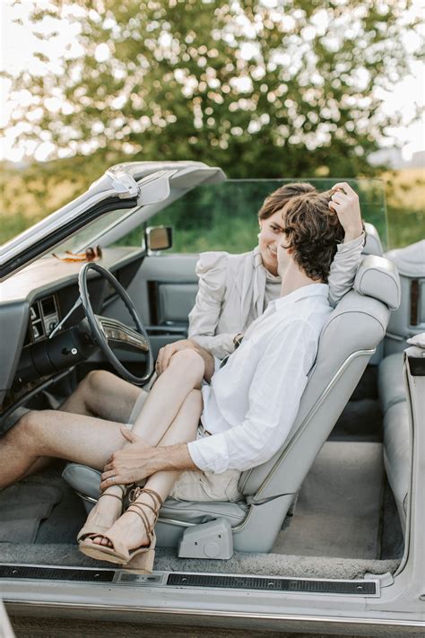 A Woman Sitting On The Mans Lap While In The Car · Free Stock Photo