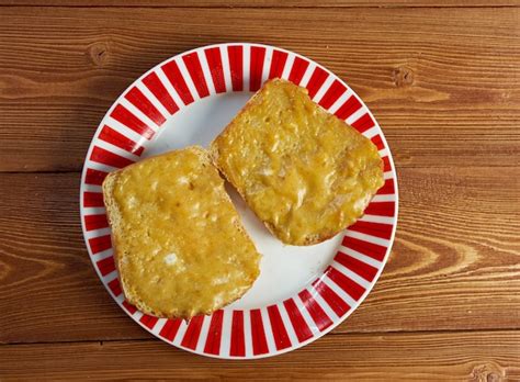 Premium Photo Welsh Rarebit Toasted Bread With Melted Cheddar Cheese