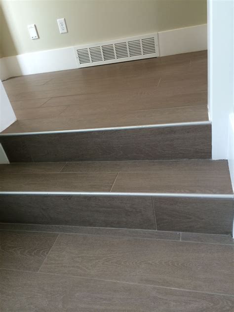 Wood Floor Tile On Stairs With Metal End Cap Tile Stairs Stairs