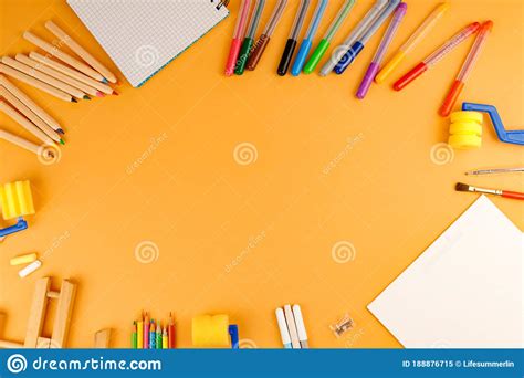 Various School Supplies On Orange Background Ready For Your Design