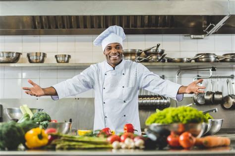 Handsome African American Chef Standing With Open Arms Stock Photo