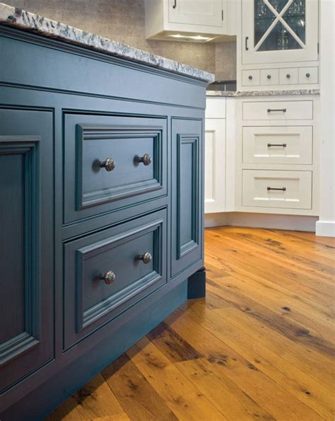 This kitchen is designed with a natural wood floor, light wood countertops, shaker cabinets, blue mountain style kitchen photo with a farmhouse sink, gray stone floor, shaker cabinets, distressed. Peacock Blue Painted Kitchen Cabinets. Gorgeous color and ...
