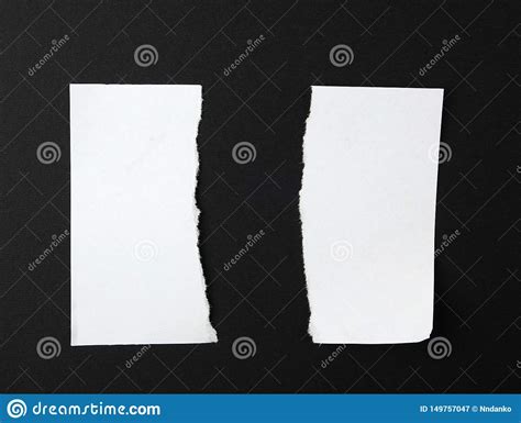 Torn In Half Empty White Sheet Of Paper On Black Background Stock Image