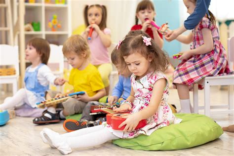 Children Learning Musical Instruments On Lesson In Kindergarten Rootz