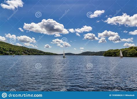 Boats In The Windermere Lake With Little Fluffy Clouds Above Stock