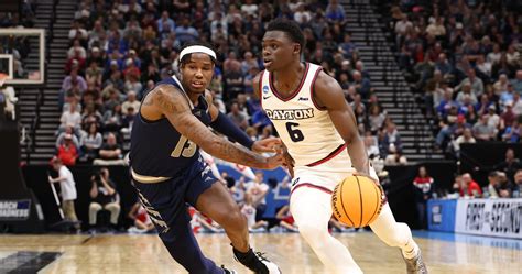 No. 7 Dayton Stuns March Madness Fans with Rally to Avoid No. 10 Nevada width=