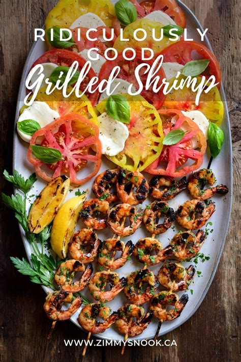 An Image Of Four Ridiculously Good Grilled Shrimp On A Plate With
