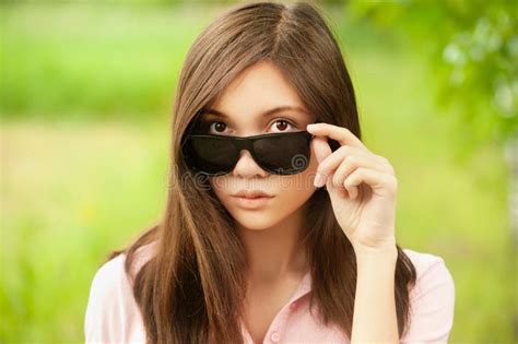 Asian Girl With Sunglasses On Looks So Seriously Cause She Is Shy Being