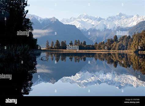Perfect Mountain Reflection In Lake Matheson With Mount Tasman And