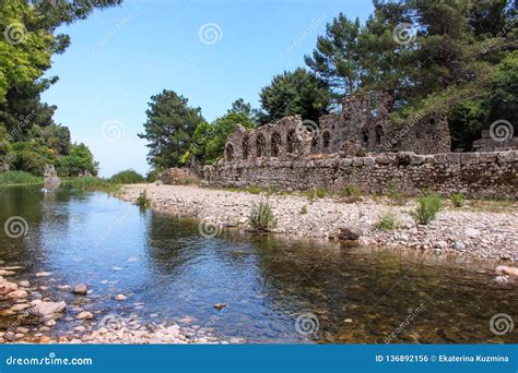 The Ruins Of An Ancient Greek City In Green Trees On The Mediterranean