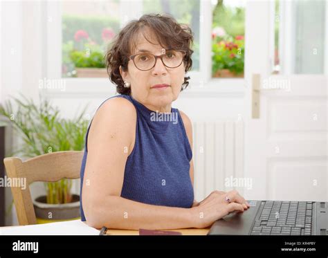 Portrait Of A Mature Woman With Glasses Stock Photo Alamy