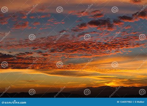 Alto Cumulus Clouds In Vibrant Dramatic Spanish Sunset Stock Photo
