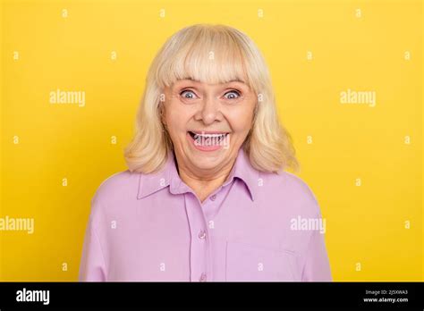 Portrait Of Attractive Cheerful Amazed Grey Haired Granny Good News