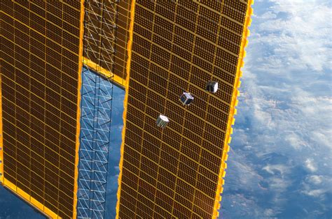 Surreal Photos Cubesats Launched From The Space Station Universe Today