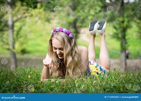 Beautiful Blonde Girl Lying On The Grass And Smiling Stock Image Image Of Face Light