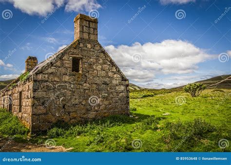 Summery Old Abandoned Glenfenzie Farmhouse Ruin In Scotland Stock Photo