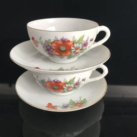 Vintage Pair Of Japanese Demitasse Tea Cups And Saucers Bright Orange Flowers Purple Violas