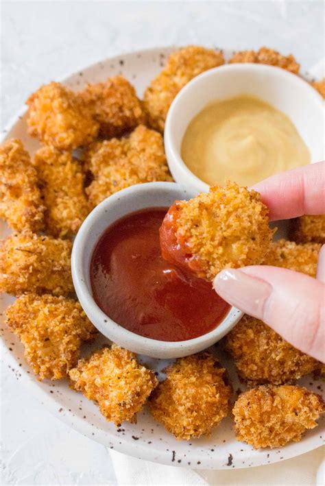 These air fryer chicken nuggets are golden, delicious, and full of amazing flavor. Homemade Air Fryer Chicken Nuggets - Carmy - Run Eat Travel