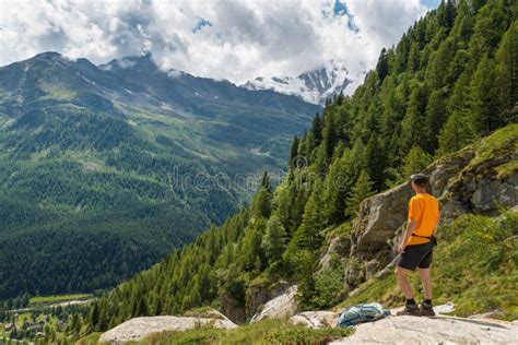 Hiking In The Italian Alps Hiker With Backpack Look At The Panorama
