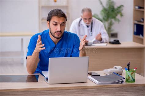 Two Doctors Working In The Clinic Stock Image Image Of Doctor Practice 214532257