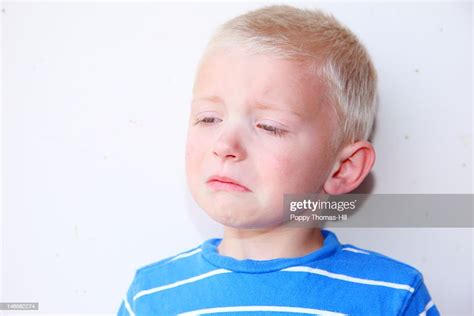 Boy With Unhappy Sad Expression High Res Stock Photo Getty Images
