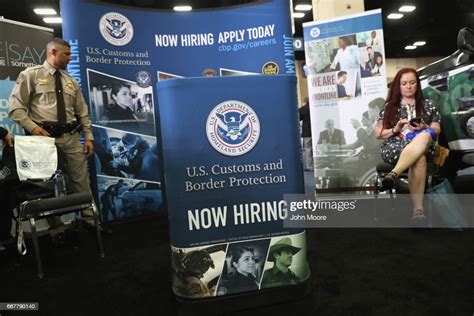 A Homeland Security Agent Mans An Exhibit At The Border Security Expo