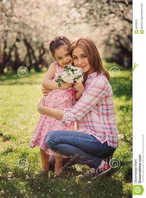 Spring Vertical Portrait Of Happy Mother And Kid Daughter Stock Photo 