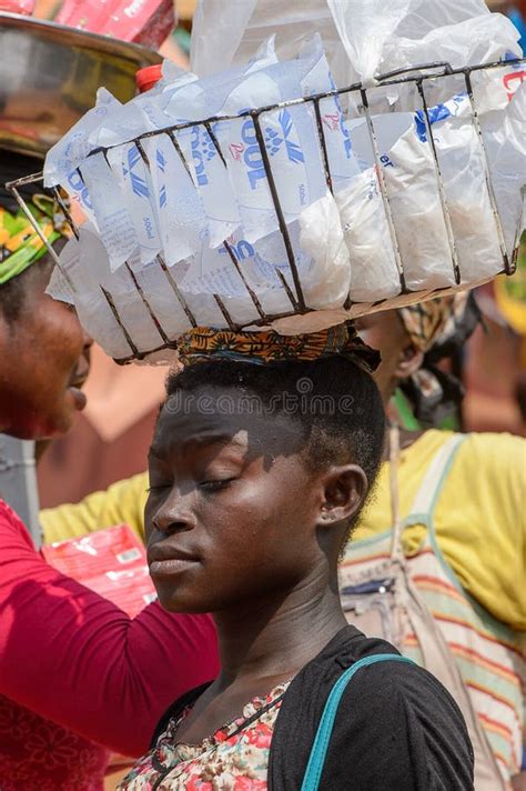 unidentified ghanaian woman carries a basket on her head in loc editorial photography image of