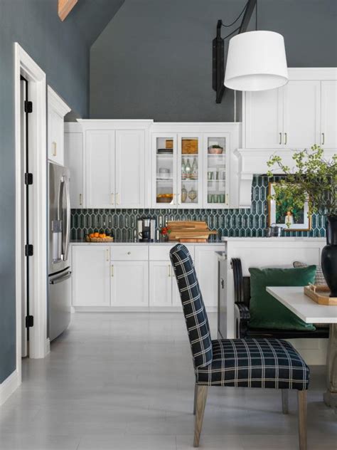 Using navy blue cabinets on the lower section keeps the kitchen feeling grounded and adds a dash of color to the space that feels young and modern. Pictures of the HGTV Smart Home 2019 Front Yard | HGTV ...