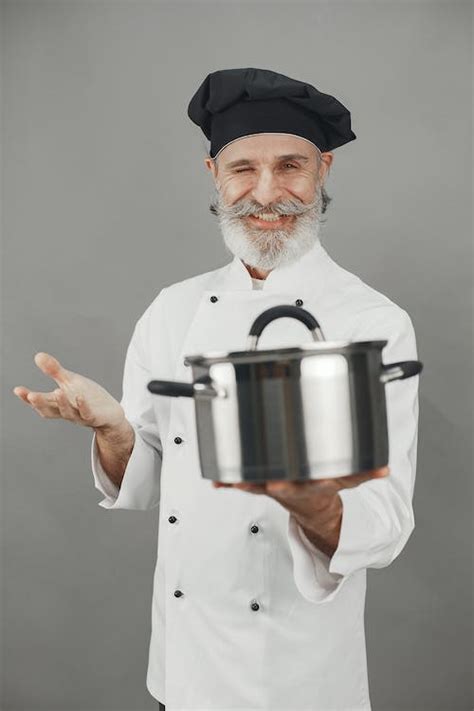 A Chef Holding A Cooking Pot · Free Stock Photo