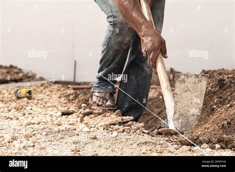 Man Digging A Hole In The Ground With Shovel Stock Photo Alamy