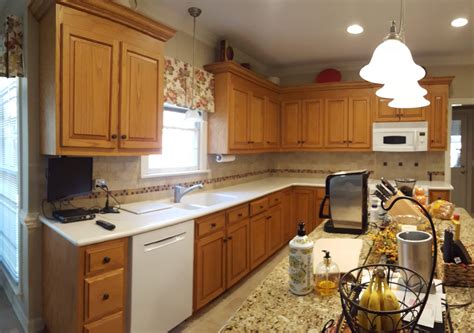 This color goes well with brown cabinets like oak, with its beige base and specs of cream, brown, and gold. Color Match - Oak Kitchen & Laundry cabinets - 2 Cabinet Girls