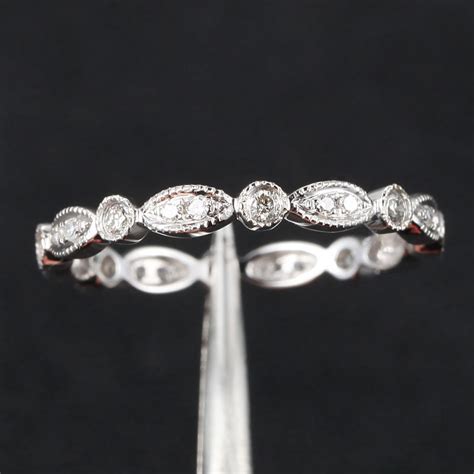 Twist wedding bands symbolize love and faithfulness of people to each other. Art Deco Antique Style .32ct Diamond Milgrain 14K White ...