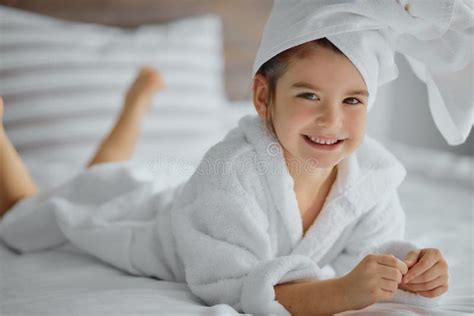 Caucasian Little Girl Wearing White Towel On Head After Shower Or