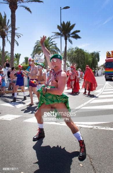 A Man Walks Lifts His Kilt During The Gay Pride Parade At The Photo