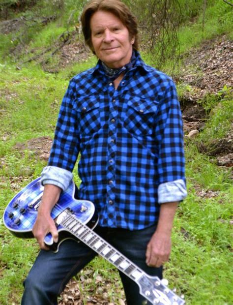 john fogerty with one of his many guitars he has a massive collection