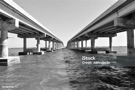 Black And White Causeway Bridge Over Water Stock Photo Download Image