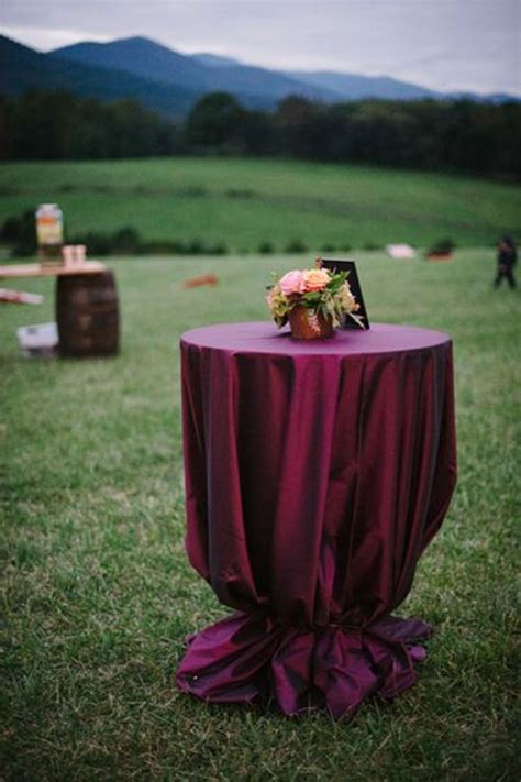 White pillar candles and greenery atop cocktail tables. Pin on wedding ideas 2016