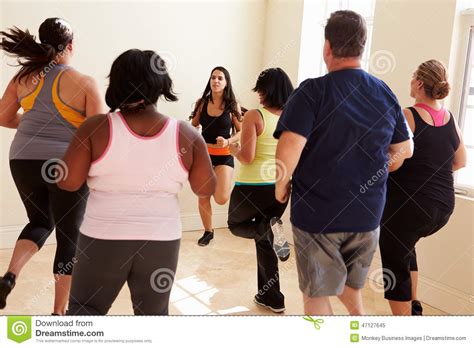 Fitness Instructor In Exercise Class For Overweight People Stock Image