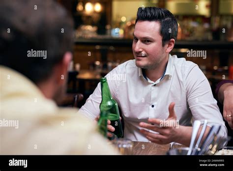 Handsome Men Drinking Beer In The Pub Stock Photo Alamy