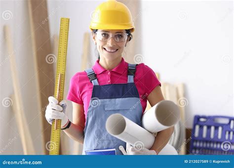 Woman Architect Holding Ruler And Paper In Workshop Stock Image Image